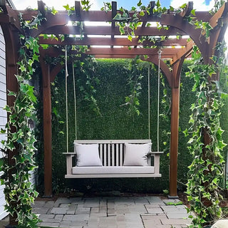 Outdoor Patio Sanctuary with Artificial Greenery and Swing Bench